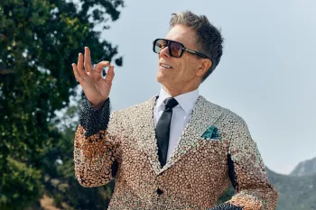 Kevin Bacon, outdoors, in a suit made of beans