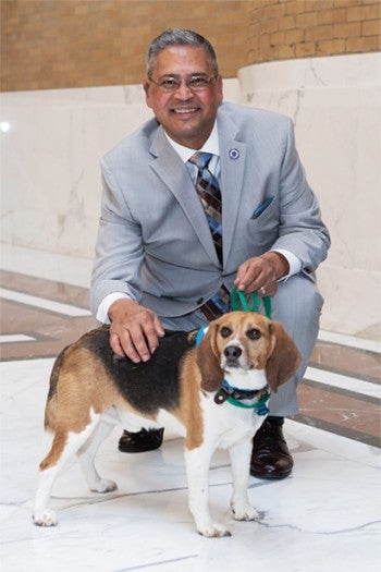 Former Massachusetts state legislator Jose Tosado with Louie, who was previously used in research.