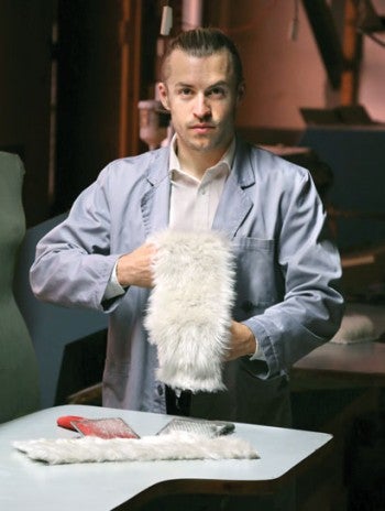 Man holding a sample of BioFluff's plant-based fur.