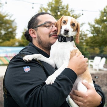 Penny the beagle with her owner