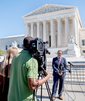 Jonathan Lovvorn being interviewed outside the capitol building. 