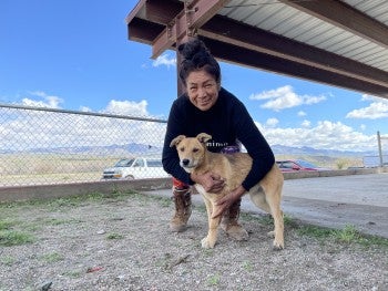 Woman hugging a dog