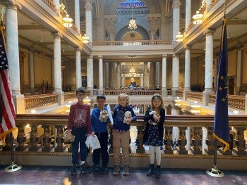 A group of children in the state capitol