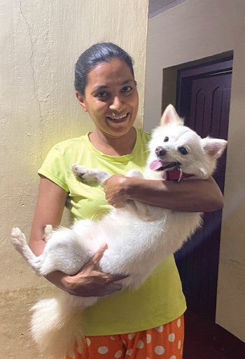 Woman holding a dog