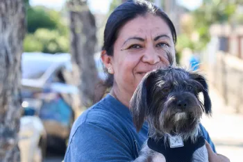 a person holding a dog