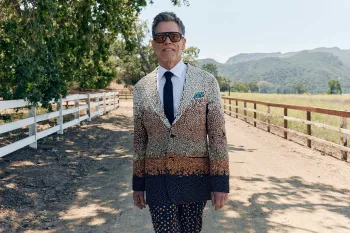 Kevin Bacon wearing a suit made of beans