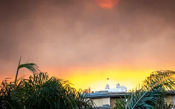 Smoke from the wildfire lights up the morning sunrise over downtown Los Angeles, CA.