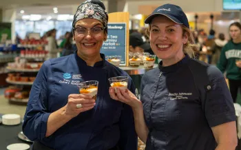 Chef Jen and Chef Tracy serving Thai Tea Tiramisu